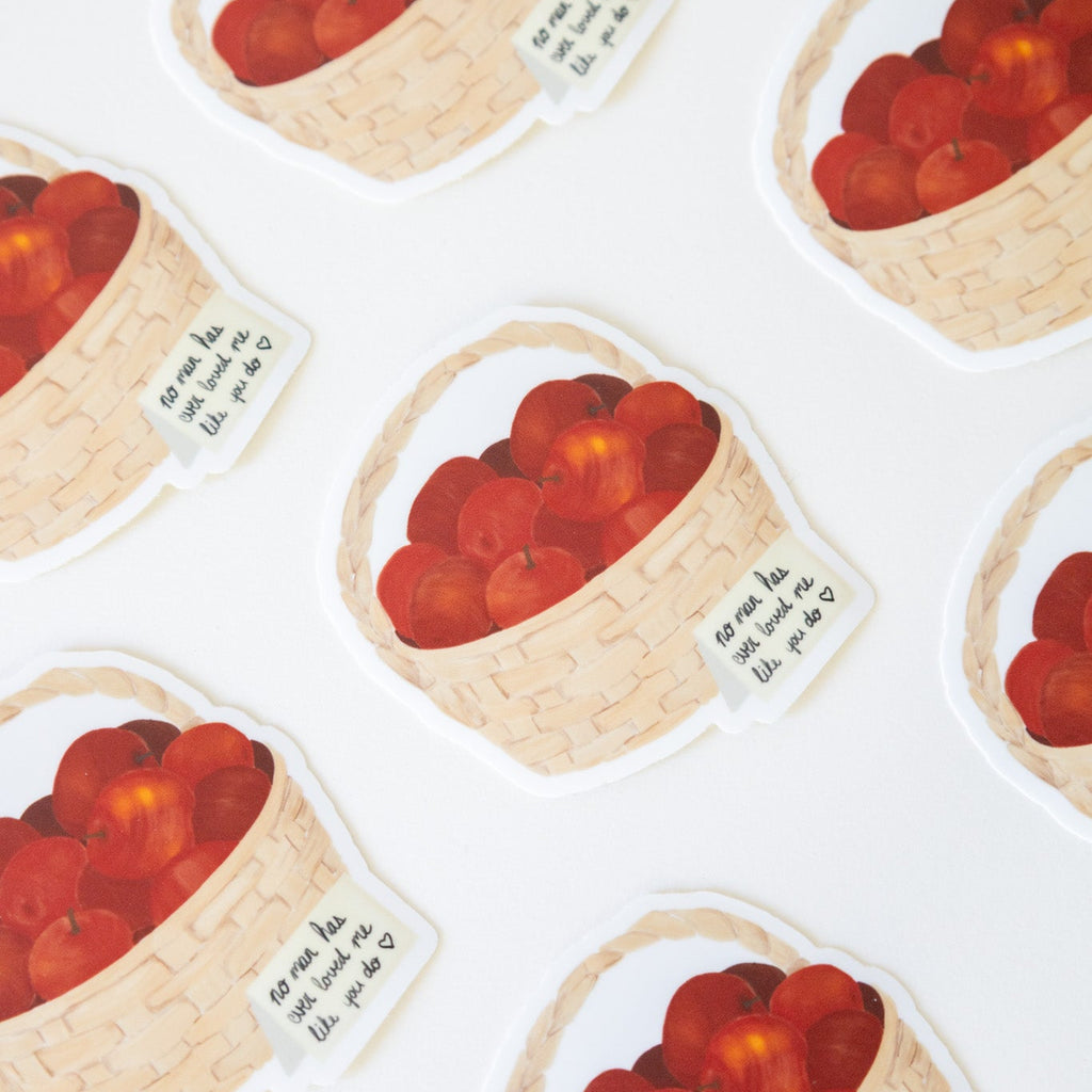 Stickers with images of a basket of red fruits and text on a white background