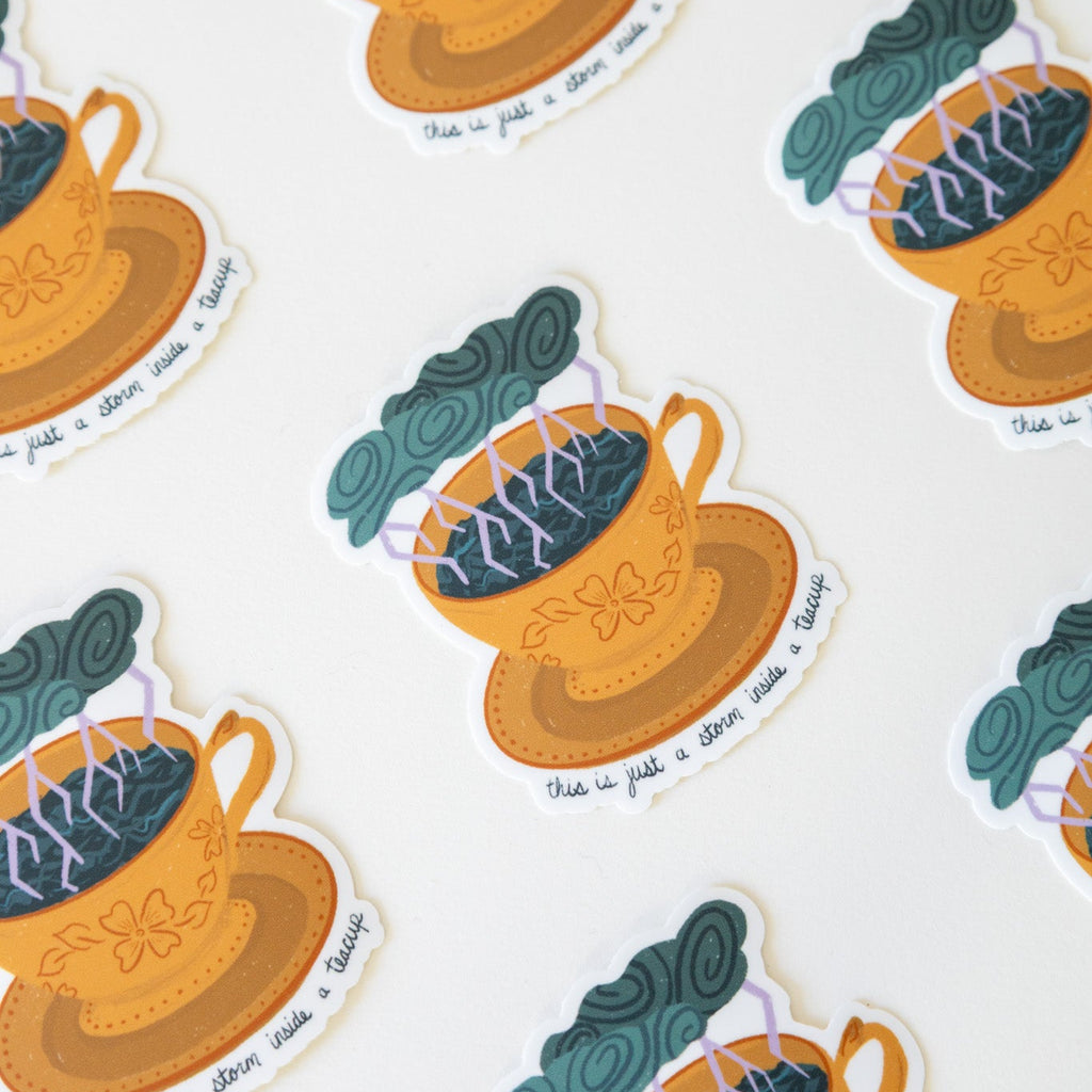 Teacup and saucer stickers with storms on a white background