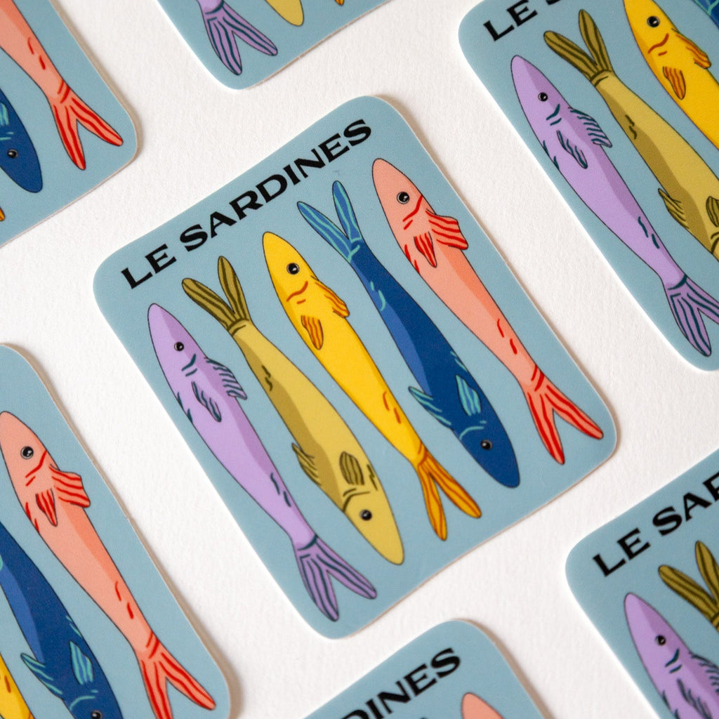 Colorful 'Le Sardines' card design with fish illustrations on a white background
